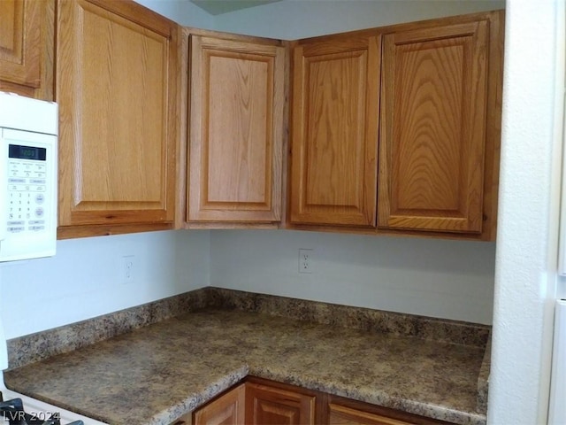 1501 Linnbaker Ln Unit 103, Las Vegas, NV 89110 - kitchen with white microwave