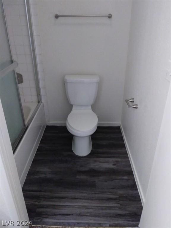 1501 Linnbaker Ln Unit 103, Las Vegas, NV 89110 - full bath with wood finished floors and bath / shower combo with glass door