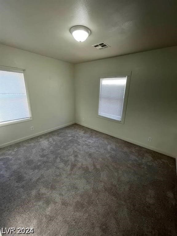 unfurnished room featuring carpet flooring