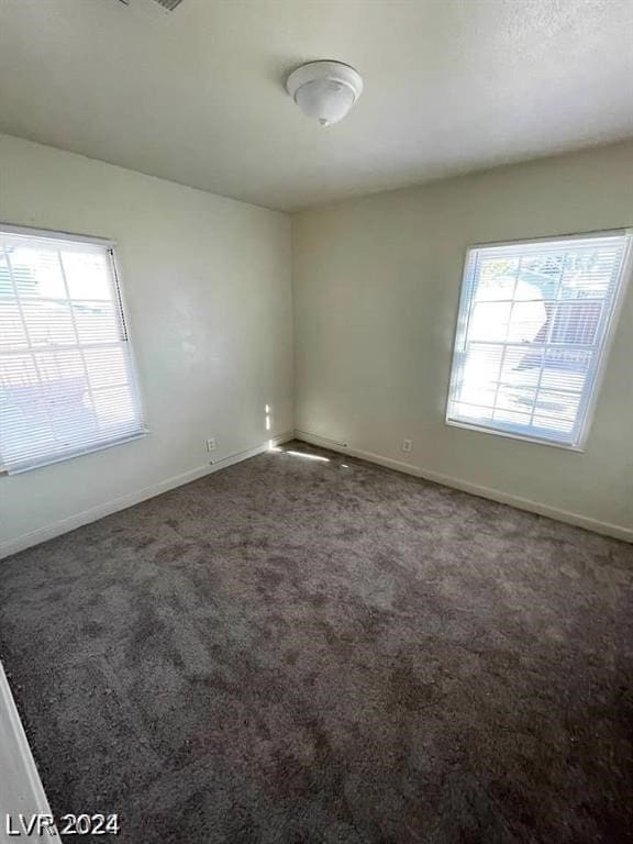 unfurnished room with carpet floors