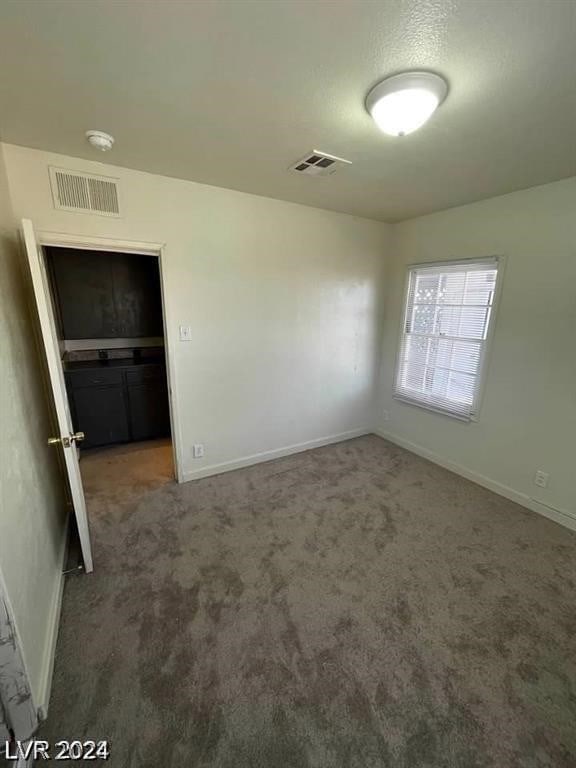 unfurnished bedroom featuring carpet