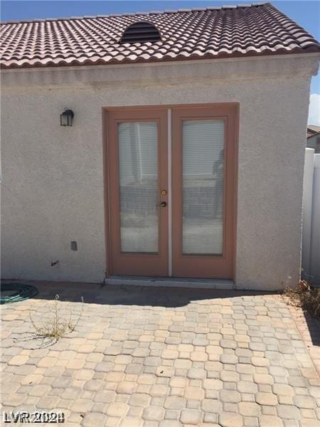 doorway to property featuring a patio