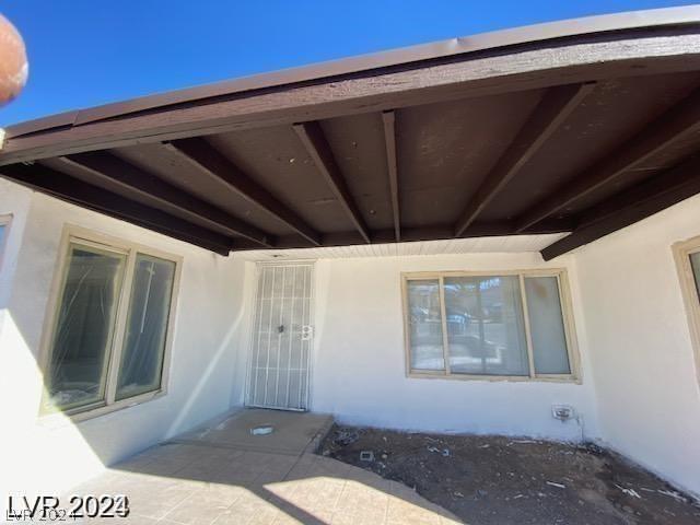 doorway to property with a patio