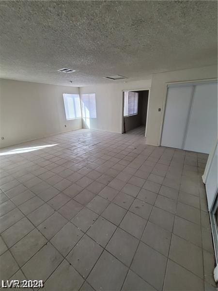 empty room with a textured ceiling