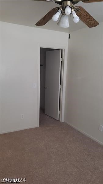 unfurnished room with carpet and ceiling fan