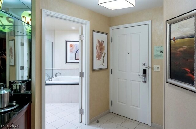 doorway to outside featuring light tile patterned floors