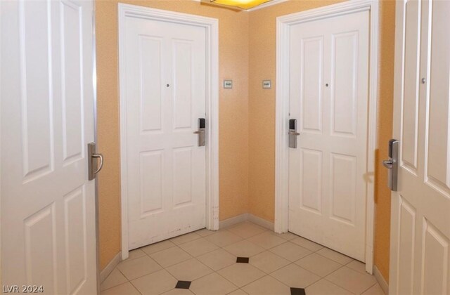 entryway featuring light tile patterned flooring