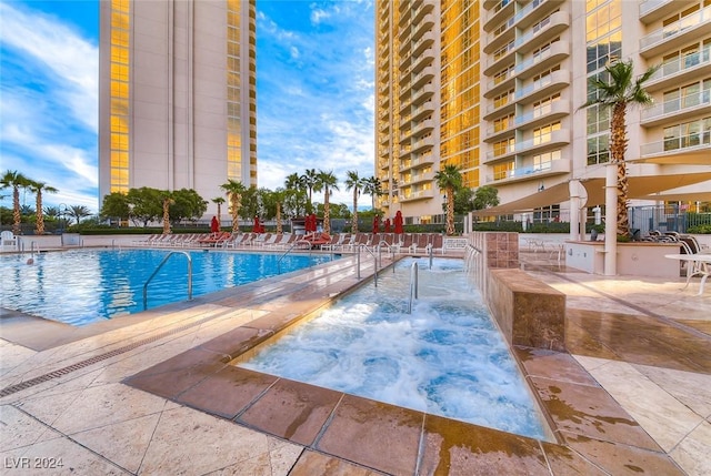 view of swimming pool featuring a patio area and pool water feature