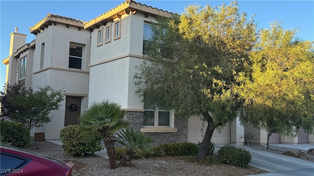 view of side of home with a garage