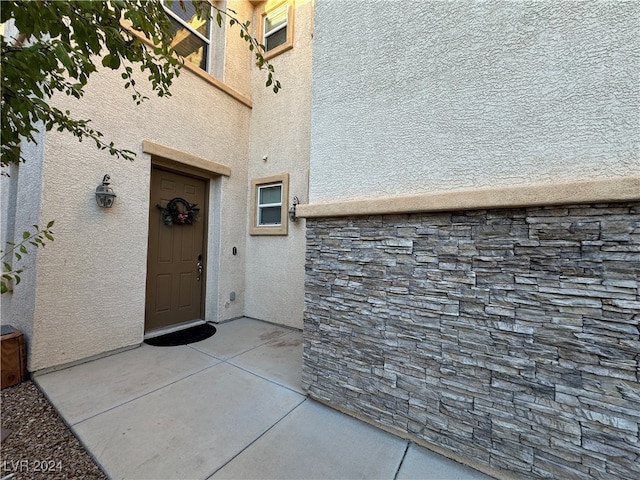 doorway to property featuring a patio