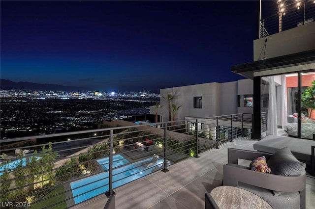 view of balcony at twilight