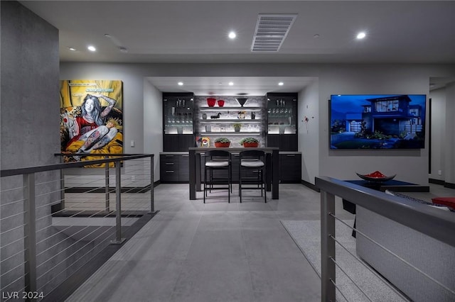 bar featuring concrete flooring