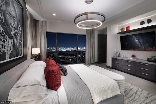 tiled bedroom featuring a notable chandelier