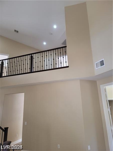 stairway featuring a high ceiling