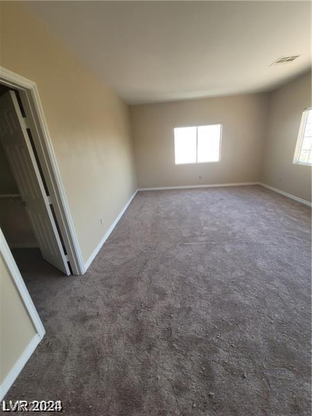 unfurnished room featuring carpet flooring