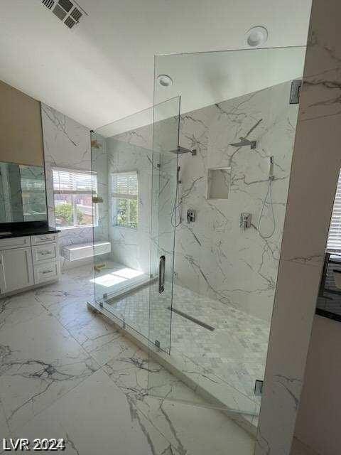 bathroom featuring vanity and walk in shower