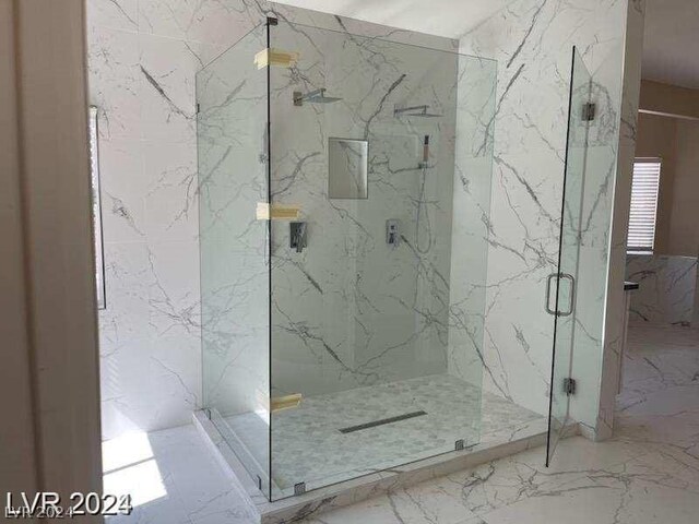 bathroom featuring tile patterned floors and an enclosed shower