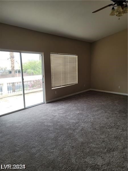 spare room with carpet floors and ceiling fan