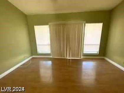 unfurnished room featuring baseboards