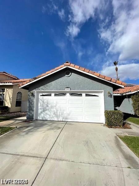 exterior space with concrete driveway