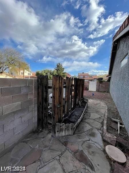 view of patio / terrace featuring fence private yard and a gate