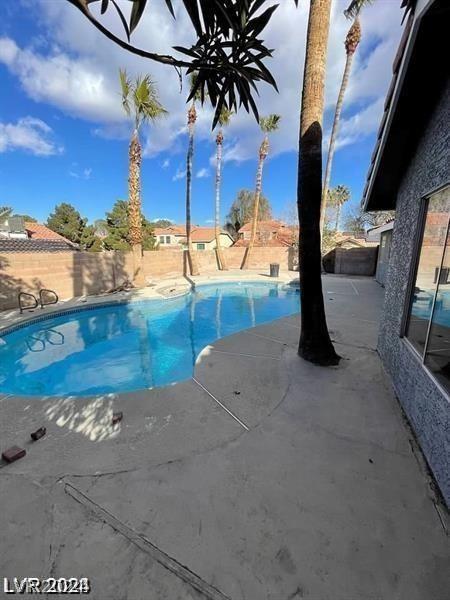 view of pool with a patio area, a fenced backyard, and a fenced in pool