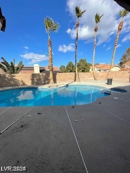 view of swimming pool featuring a fenced in pool, a patio, and a fenced backyard