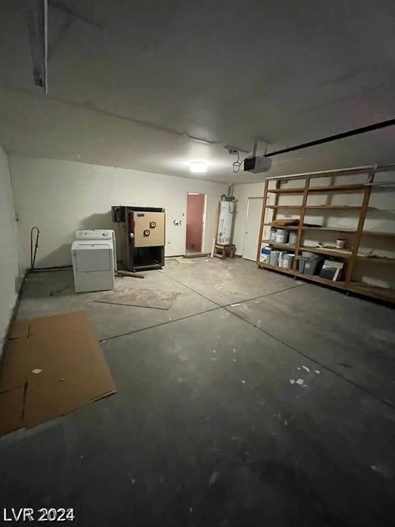 garage with washer / clothes dryer and a garage door opener