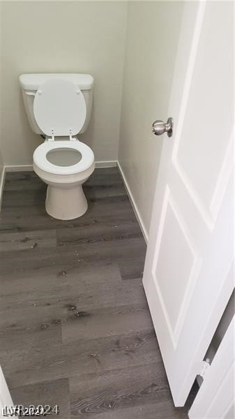 bathroom featuring toilet and hardwood / wood-style floors