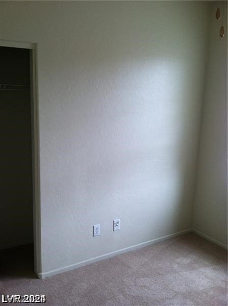 empty room featuring carpet flooring