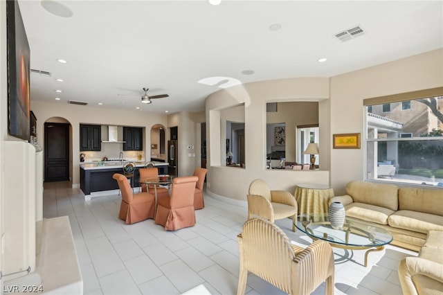 interior space with ceiling fan