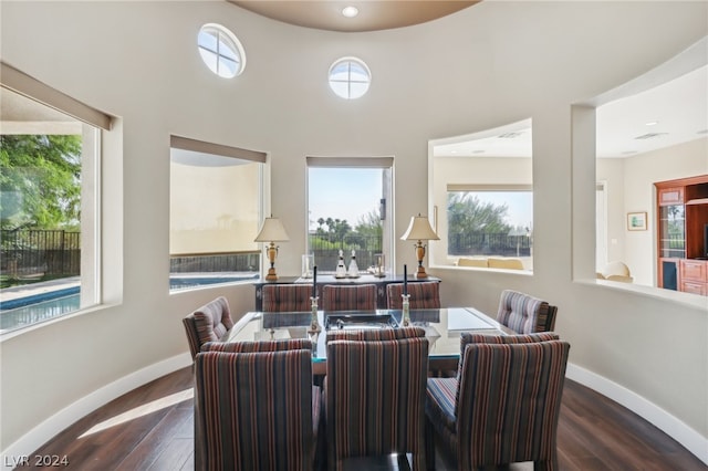 dining area featuring dark wood-type flooring