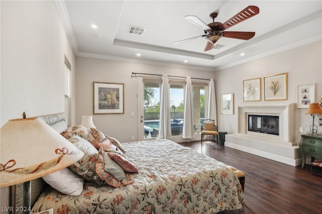 bedroom featuring access to outside, ornamental molding, a raised ceiling, dark hardwood / wood-style flooring, and ceiling fan