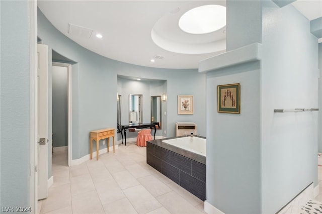 bathroom featuring tile patterned flooring and a washtub