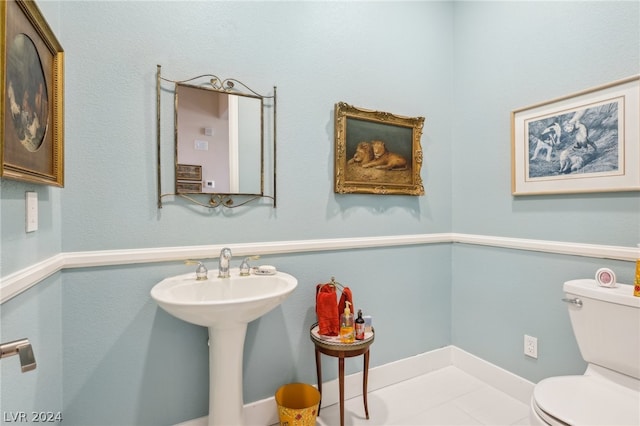 bathroom with toilet and sink