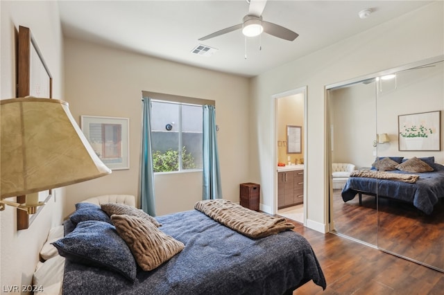 bedroom with hardwood / wood-style floors, connected bathroom, ceiling fan, and a closet