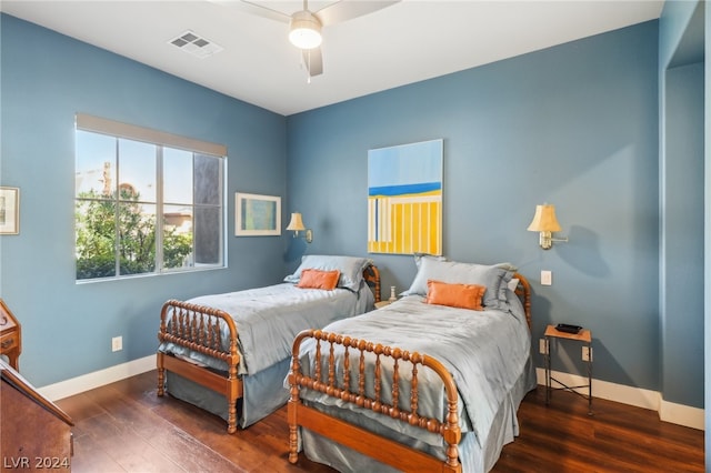 bedroom featuring ceiling fan and dark hardwood / wood-style floors