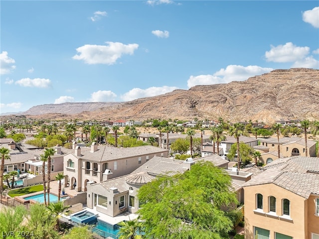 birds eye view of property with a mountain view