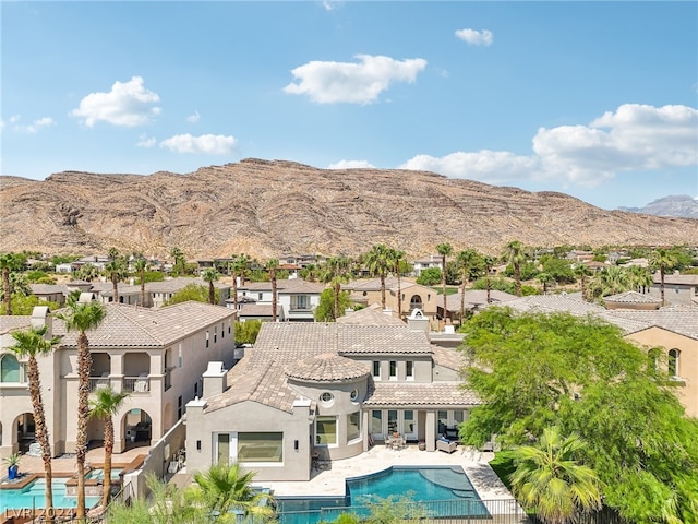 view of pool featuring a patio and a mountain view