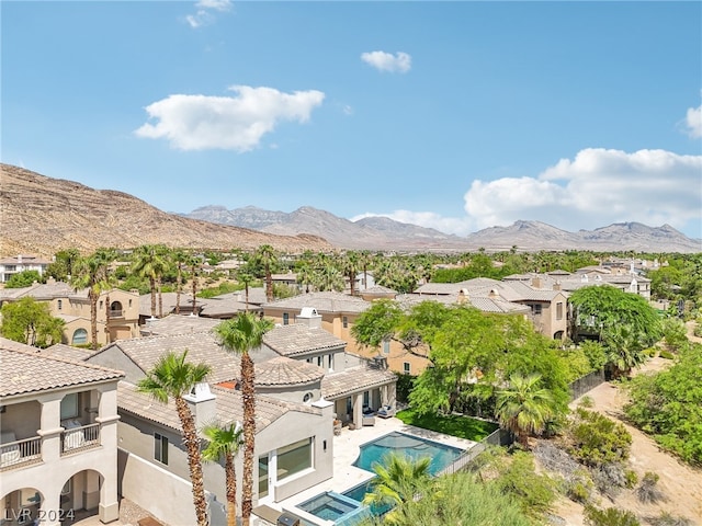 birds eye view of property with a mountain view