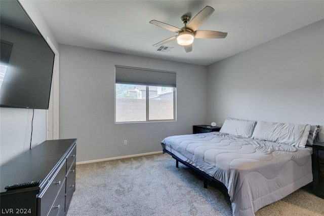 bedroom featuring ceiling fan and light colored carpet