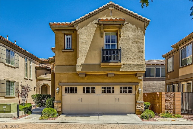 view of front of house with a balcony and a garage