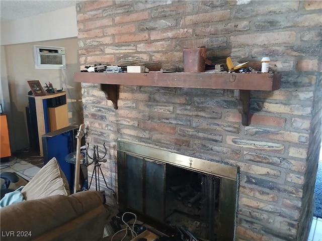 details with a wall mounted air conditioner and a brick fireplace