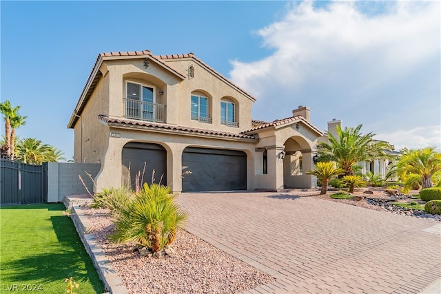 mediterranean / spanish house featuring a garage