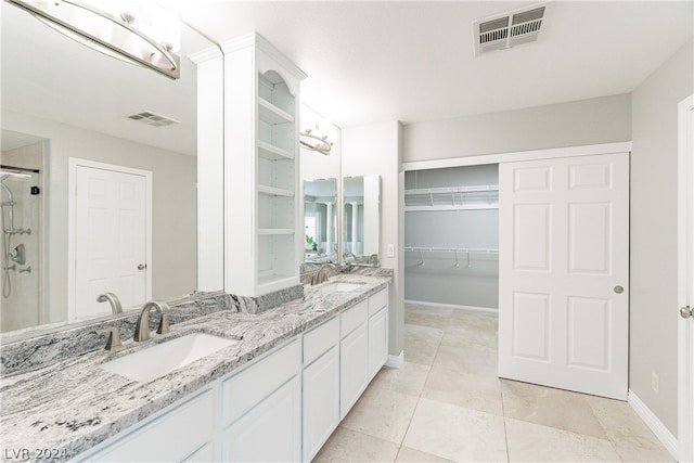 bathroom featuring vanity and an enclosed shower