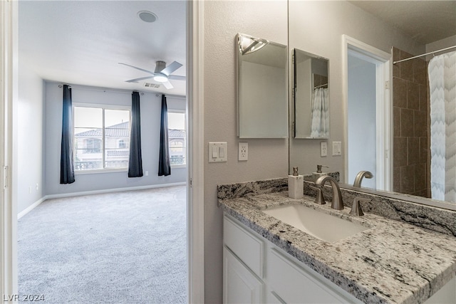 bathroom featuring vanity, a shower with shower curtain, and ceiling fan