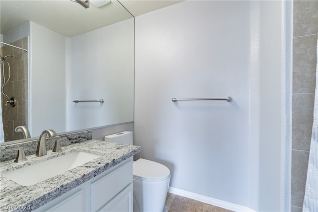 bathroom featuring a shower with curtain, toilet, and vanity