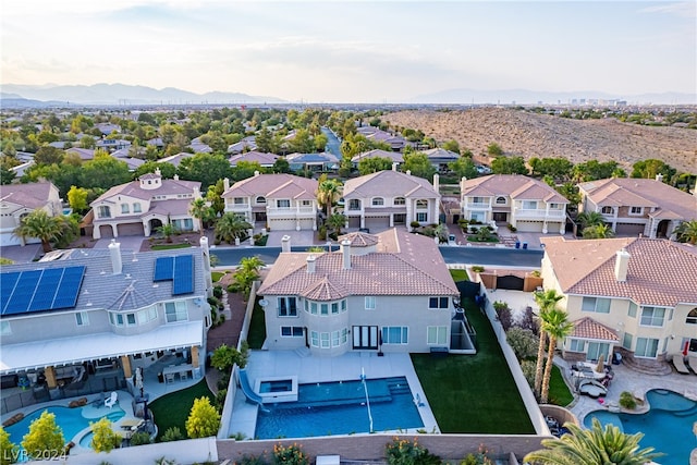 birds eye view of property featuring a mountain view