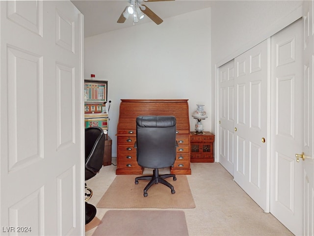 carpeted office featuring ceiling fan