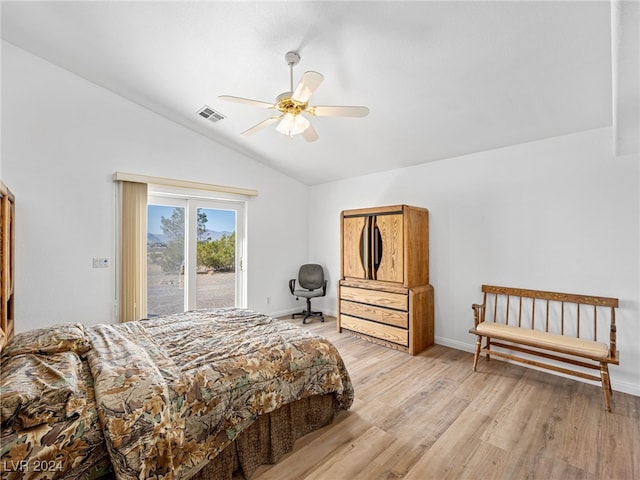 bedroom featuring ceiling fan, light hardwood / wood-style flooring, access to exterior, and lofted ceiling